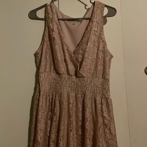 glittery pale pink lace. flowy skirt. stretchy under bust.